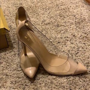 Clear plastic and tan heels